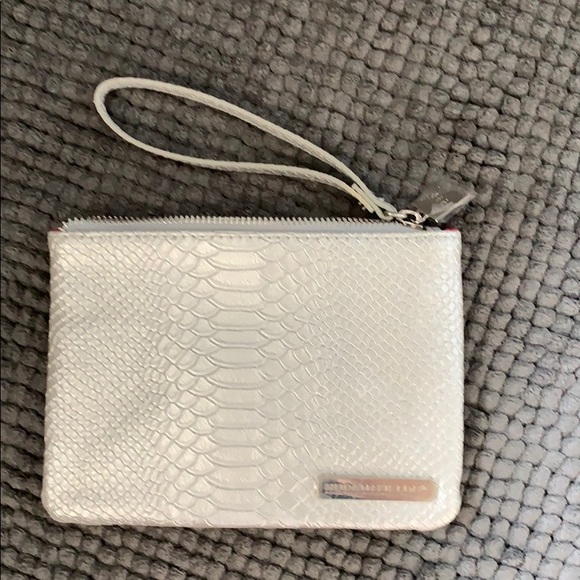 Rodan + Fields Handbags - Rodan + Fields wristlet